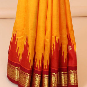 Yellow buttas kancheepuram silksaree, contrast vidarbha one-side border of salngai,neli & jaal & zari striped pallu