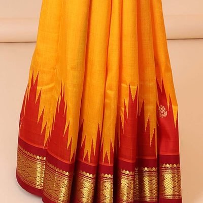 Yellow buttas kancheepuram silksaree, contrast vidarbha one-side border of salngai,neli & jaal & zari striped pallu