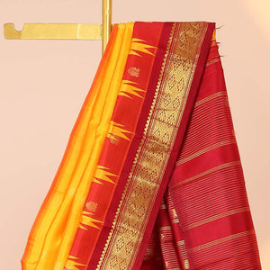 Yellow buttas kancheepuram silksaree, contrast vidarbha one-side border of salngai,neli & jaal & zari striped pallu
