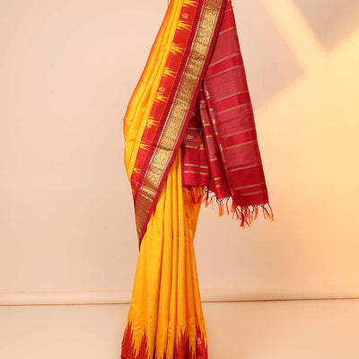 Yellow buttas kancheepuram silksaree, contrast vidarbha one-side border of salngai,neli & jaal & zari striped pallu