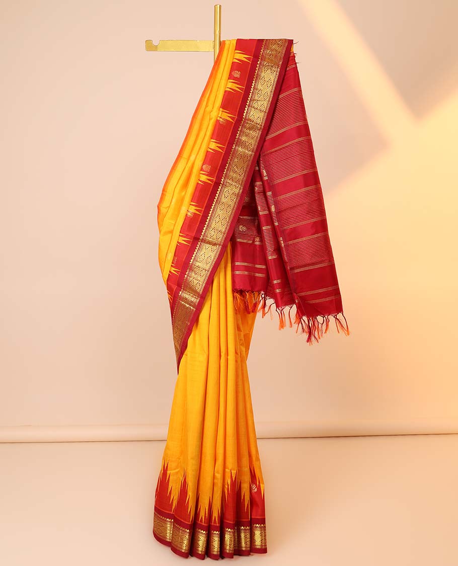 Yellow buttas kancheepuram silksaree, contrast vidarbha one-side border of salngai,neli & jaal & zari striped pallu