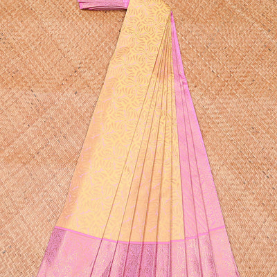 Yellow jacquard wedding silksaree, contrast diagonal striped pallu & zari border of floral jaal designs