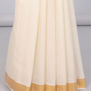 Cream kerala saree with zari designs, zari border & pallu of paisley designs in zari