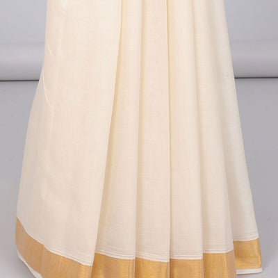 Cream kerala saree with zari designs, zari border & pallu of paisley designs in zari
