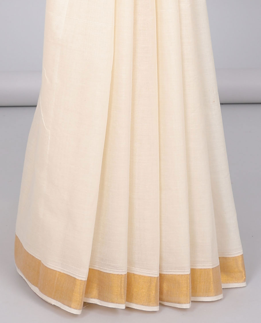 Cream kerala saree with zari designs, zari border & pallu of paisley designs in zari