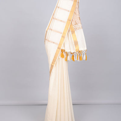 Cream kerala saree with zari designs, zari border & pallu of paisley designs in zari