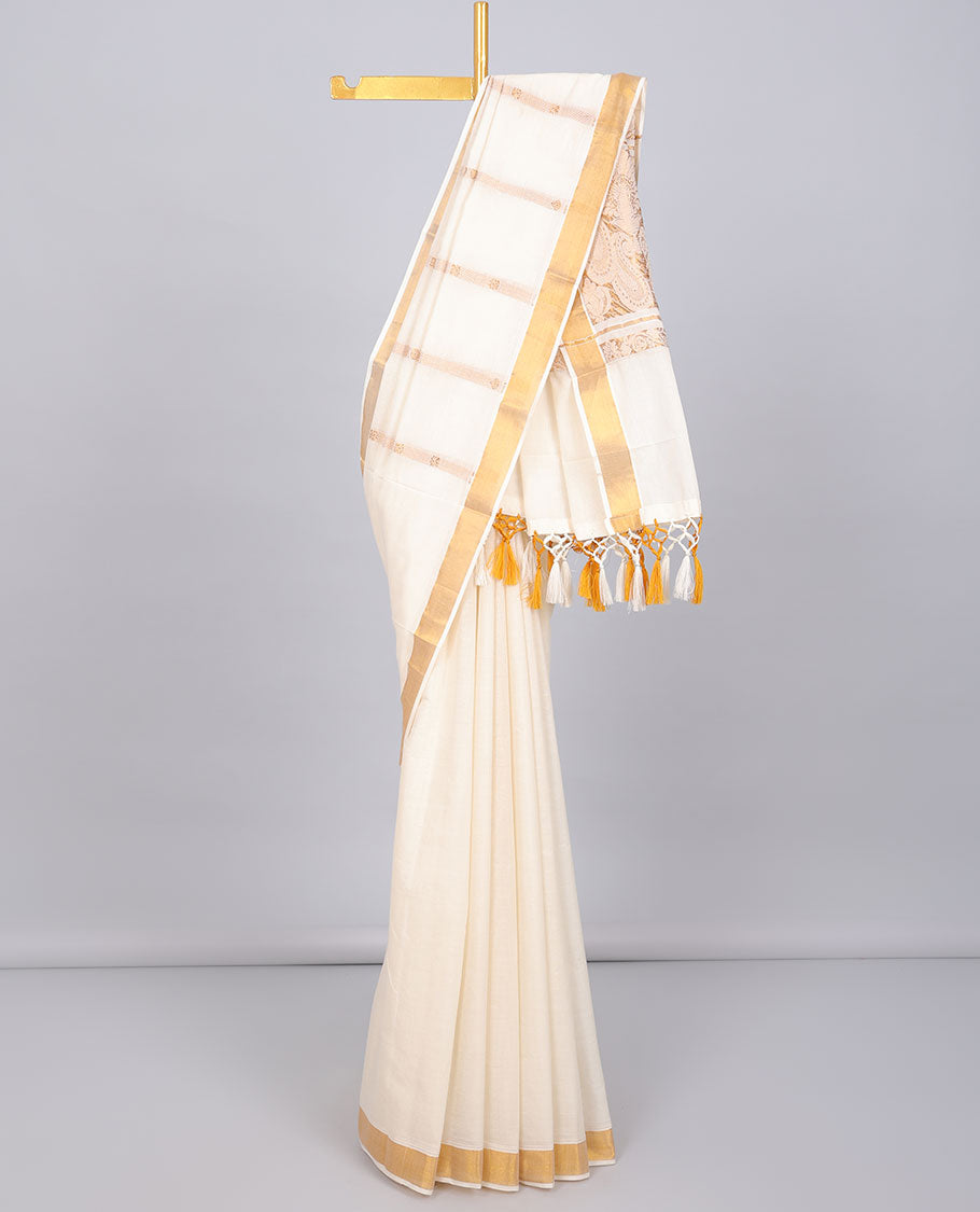 Cream kerala saree with zari designs, zari border & pallu of paisley designs in zari