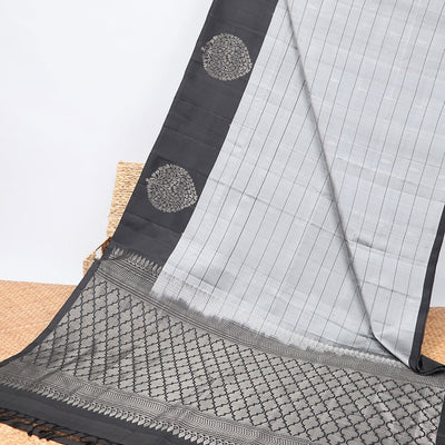 Grey checked Mayur soft silk saree with contrast leaf motifs border & argyle pattern pallu