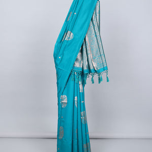 Borderless orange butter silk saree with zari buttas, contrast pallu of intricate designs in zari