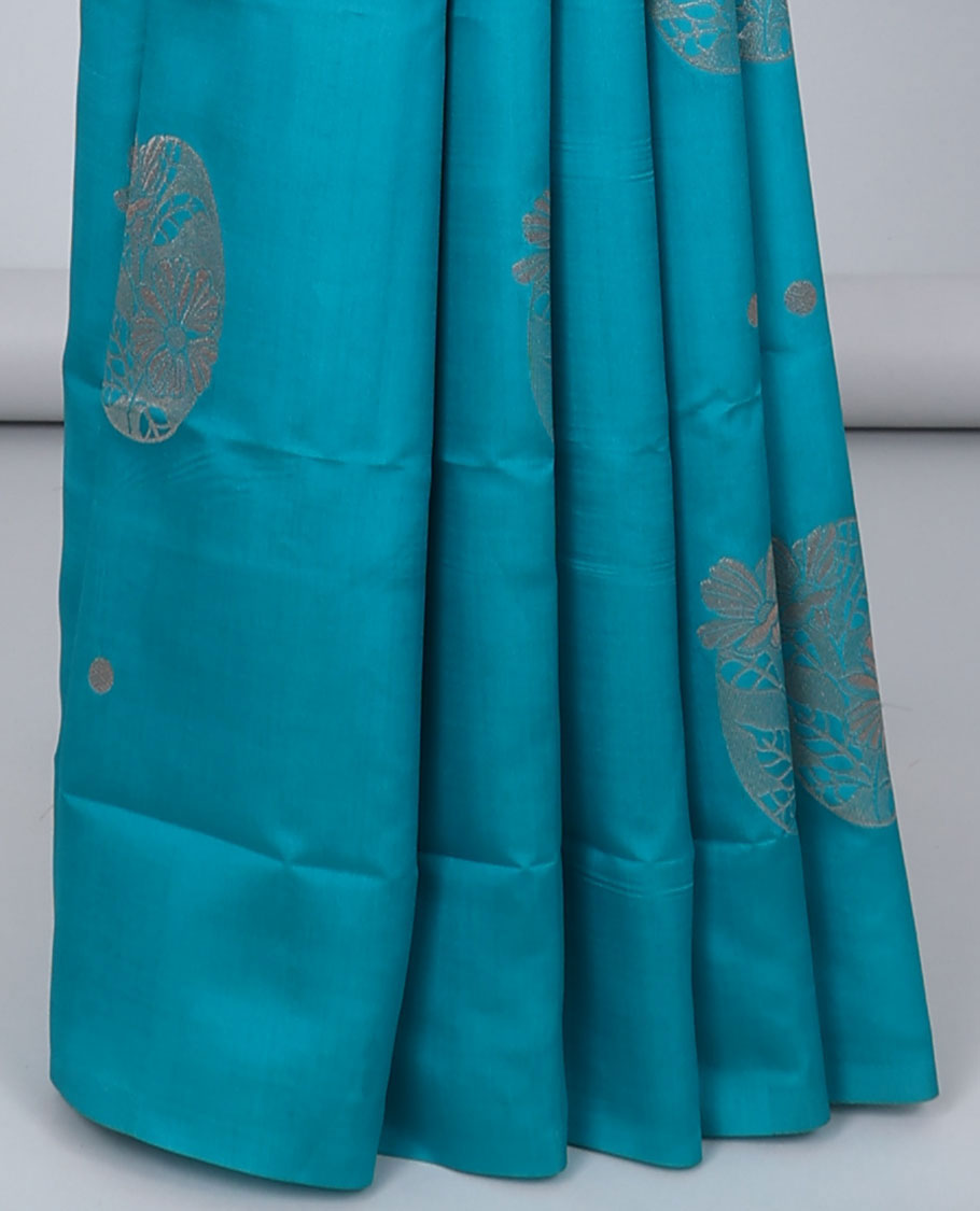 Borderless orange butter silk saree with zari buttas, contrast pallu of intricate designs in zari