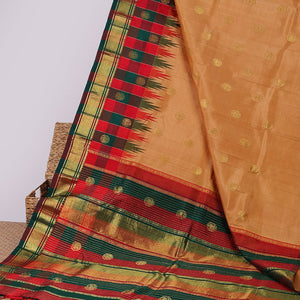 Orange buttas kancheepuram silksaree, contrast intricate zari pallu & checked temple border of thilakam mokku & banaras