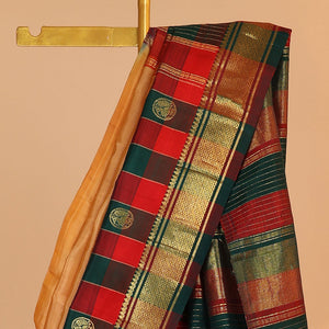 Orange buttas kancheepuram silksaree, contrast intricate zari pallu & checked temple border of thilakam mokku & banaras