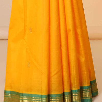 Orange zari buttas silk saree, contrast zari design pallu & zari border of rekku,banaras & mayil kann designs