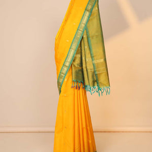 Orange zari buttas silk saree, contrast zari design pallu & zari border of rekku,banaras & mayil kann designs