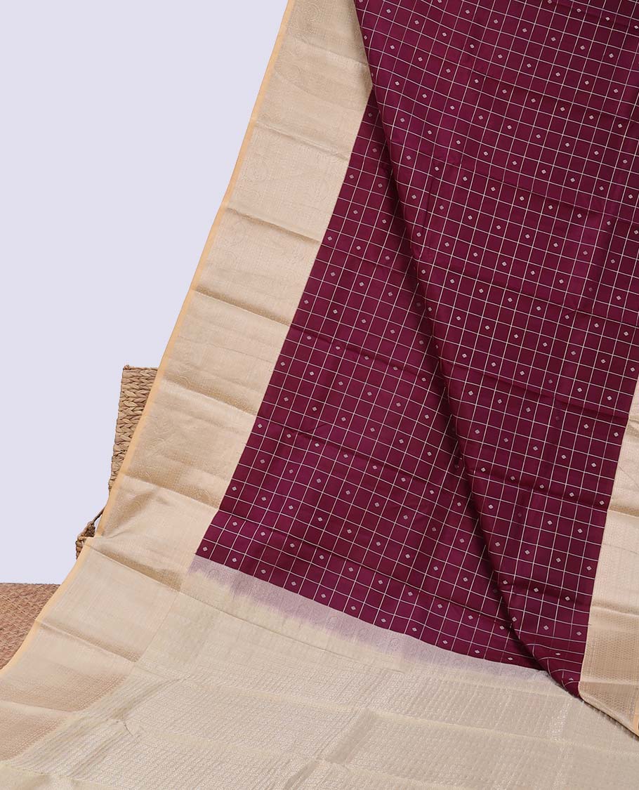 Maroon buttas & checked silk saree, contrast intricate pallu & border steeped with traditional zari motifs