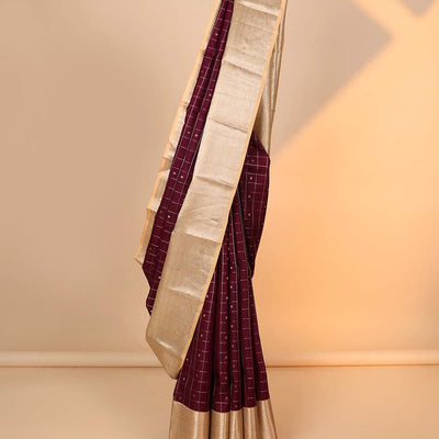 Maroon buttas & checked silk saree, contrast intricate pallu & border steeped with traditional zari motifs