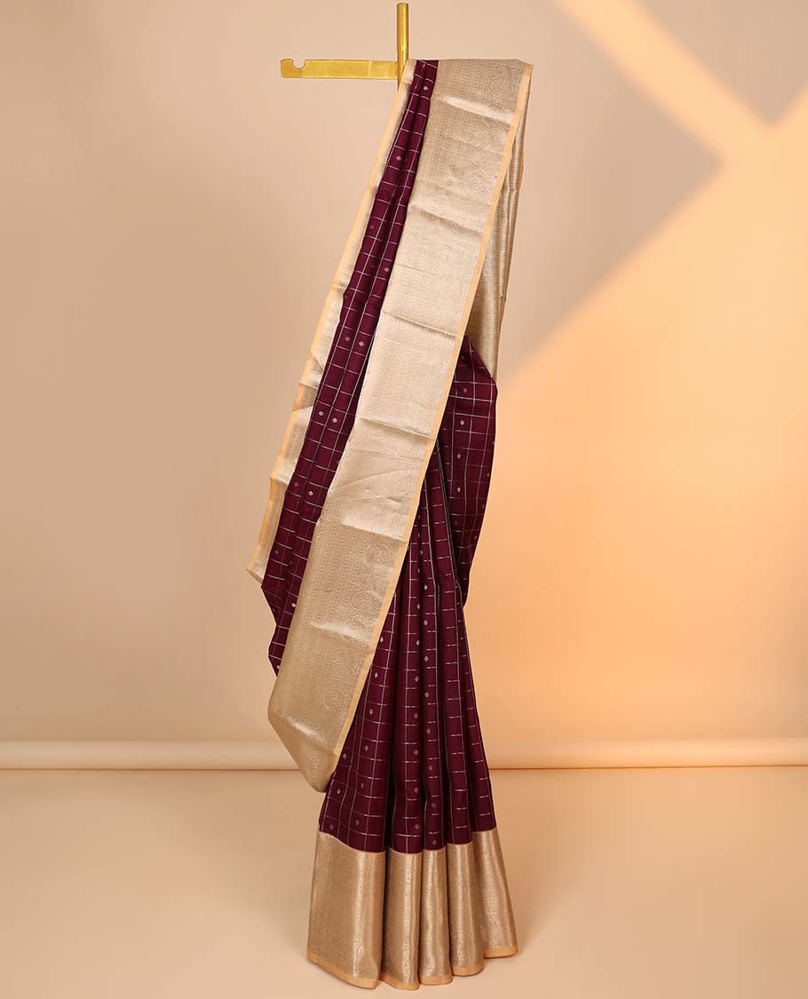 Maroon buttas & checked silk saree, contrast intricate pallu & border steeped with traditional zari motifs