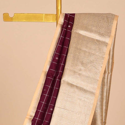 Maroon buttas & checked silk saree, contrast intricate pallu & border steeped with traditional zari motifs