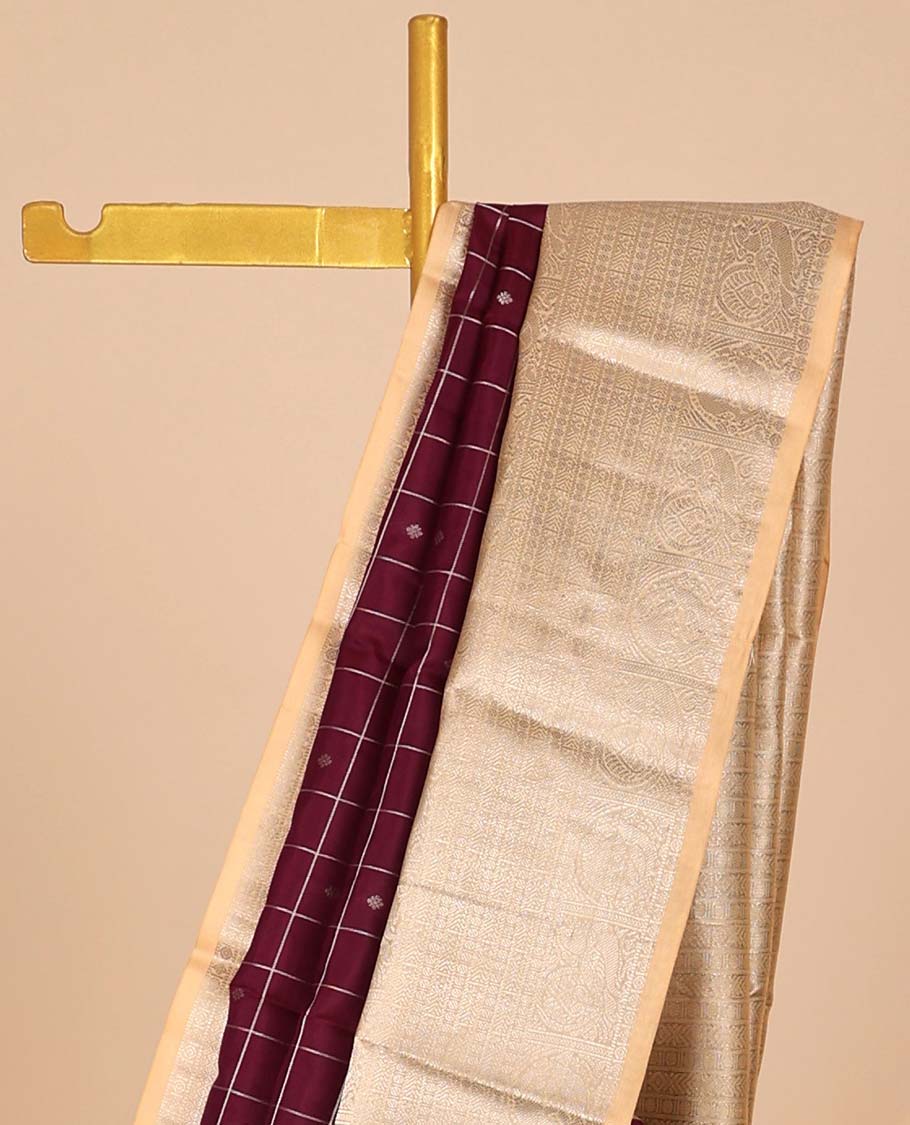 Maroon buttas & checked silk saree, contrast intricate pallu & border steeped with traditional zari motifs