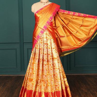 Orange jacquard pure silk half saree,jaal dhavani,contrast jacquard blouse & border of thilakam,muthu,mayil & mayil kann