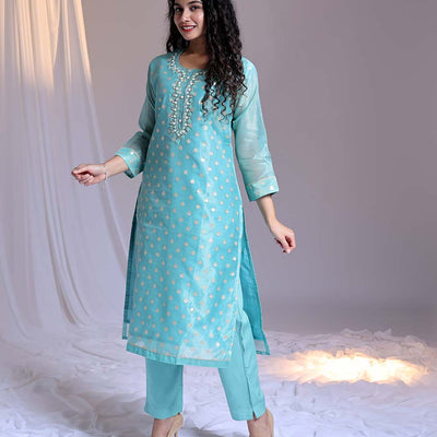 Blue readymade suit,zari buttas & embroidery round-neck tissue top,plain pants & dupatta of floral & chevron print