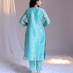 Blue readymade suit,zari buttas & embroidery round-neck tissue top,plain pants & dupatta of floral & chevron print