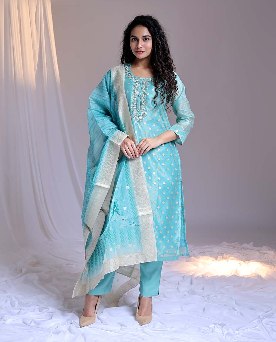 Blue readymade suit,zari buttas & embroidery round-neck tissue top,plain pants & dupatta of floral & chevron print