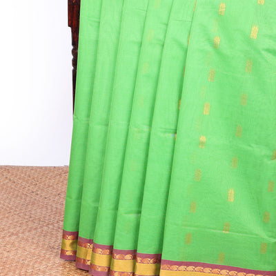 Green Andhra cotton saree with buttas, contrast traditional design border & peacock design pallu