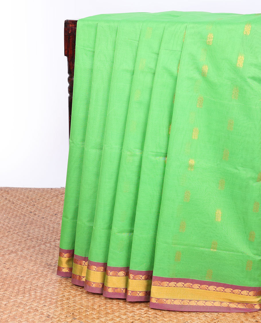 Green Andhra cotton saree with buttas, contrast traditional design border & peacock design pallu
