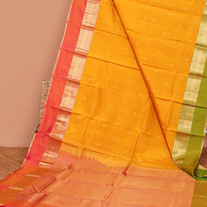 Yellow zari buttas silk saree, contrast ganga jamuna border of muthu, poun & kuyil kann &  pallu of intricate designs