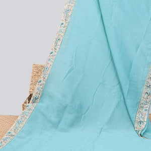 Blue plain design crushed tissue saree, contrast floral & bird embroidery border