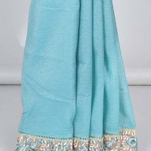 Blue plain design crushed tissue saree, contrast floral & bird embroidery border
