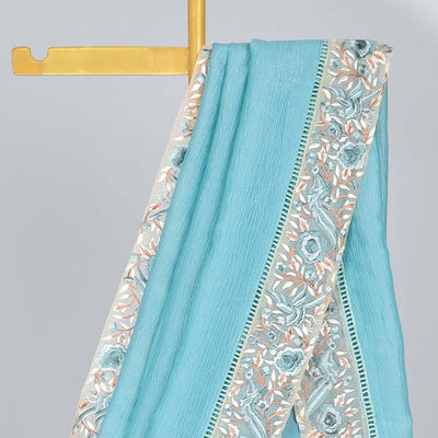 Blue plain design crushed tissue saree, contrast floral & bird embroidery border