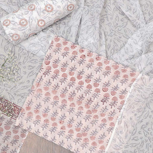 Peach material chudidhar set, floral motifs printed top, contrast bottom & dupatta of floral print
