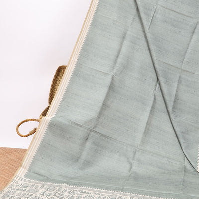 Green semi-banaras tussar saree with contrast striped border & egypt theme pallu