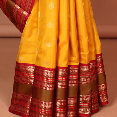 Yellow leaf buttas silk saree with contrast border of thilakam mokku, muthu, paun design & pallu of jaal design
