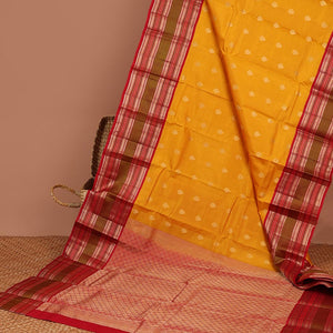 Yellow leaf buttas silk saree with contrast border of thilakam mokku, muthu, paun design & pallu of jaal design