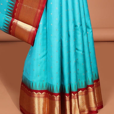 Blue buttas silk saree, contrast border of rekku,banaras & jaal & pallu of ogee pattern