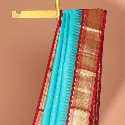 Blue buttas silk saree, contrast border of rekku,banaras & jaal & pallu of ogee pattern