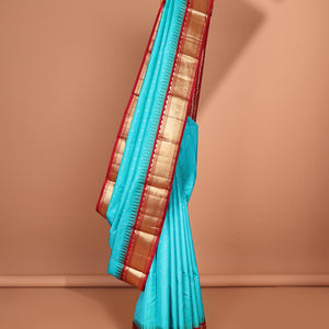 Blue buttas silk saree, contrast border of rekku,banaras & jaal & pallu of ogee pattern