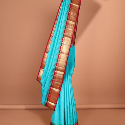 Blue buttas silk saree, contrast border of rekku,banaras & jaal & pallu of ogee pattern