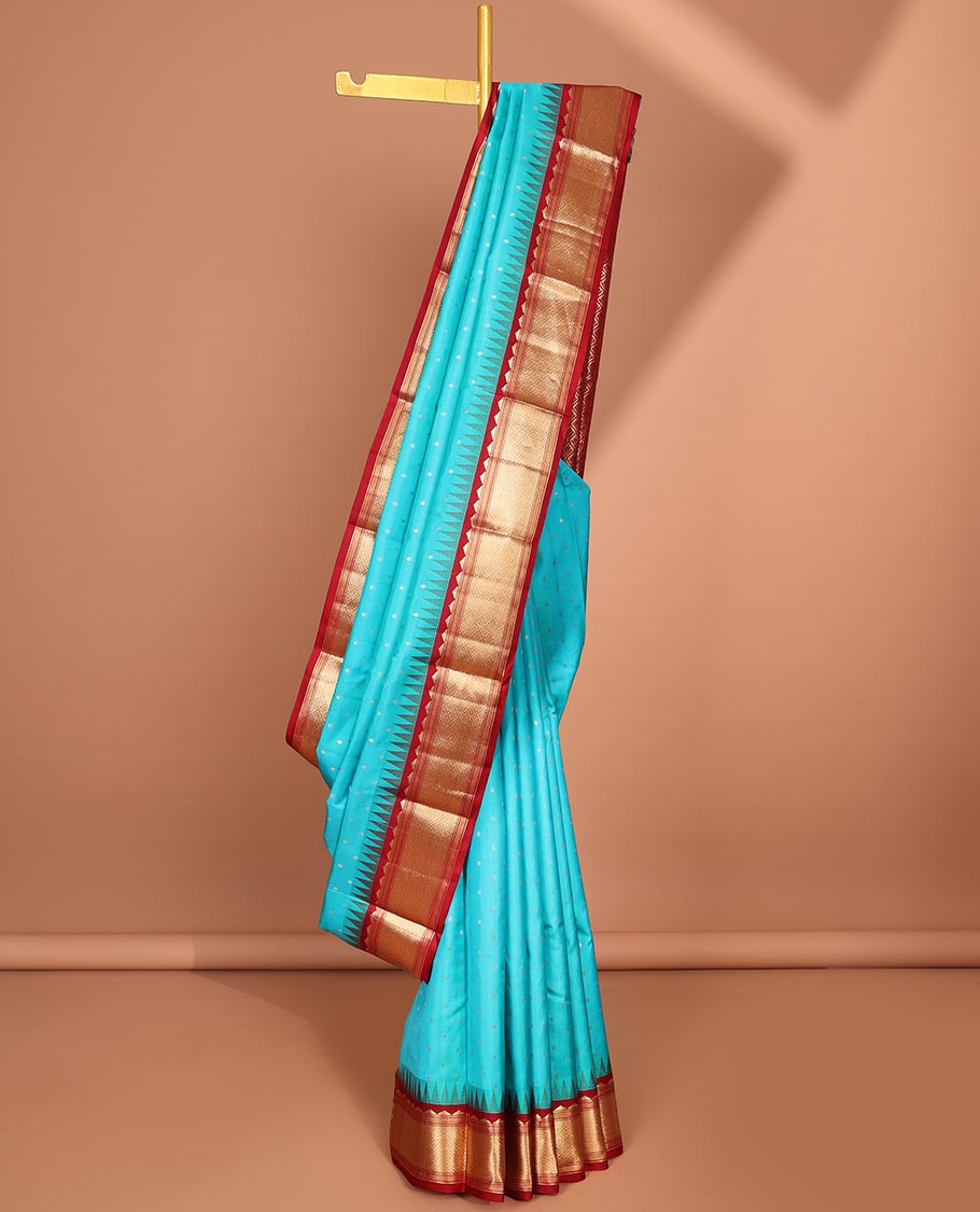 Blue buttas silk saree, contrast border of rekku,banaras & jaal & pallu of ogee pattern