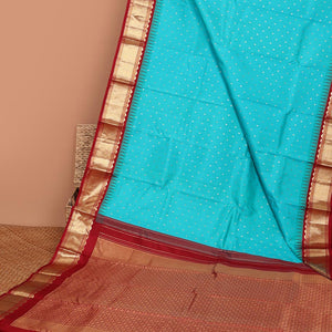 Blue buttas silk saree, contrast border of rekku,banaras & jaal & pallu of ogee pattern