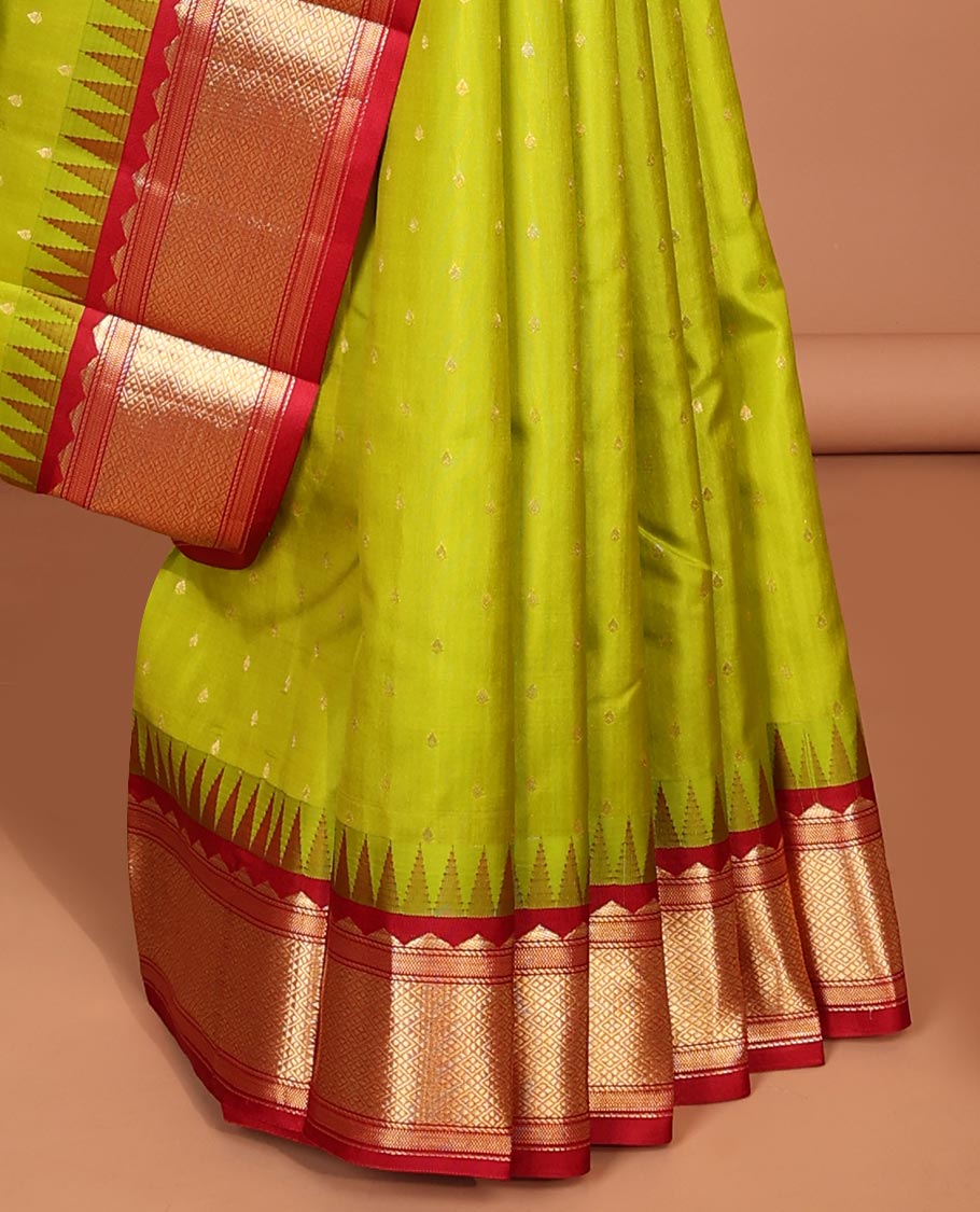 Green buttas silk saree, contrast border of rekku,banaras & jaal & pallu of ogee pattern