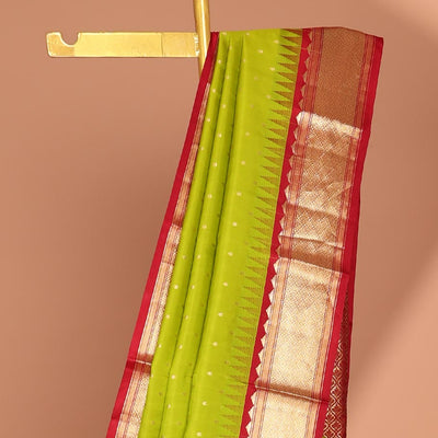 Green buttas silk saree, contrast border of rekku,banaras & jaal & pallu of ogee pattern