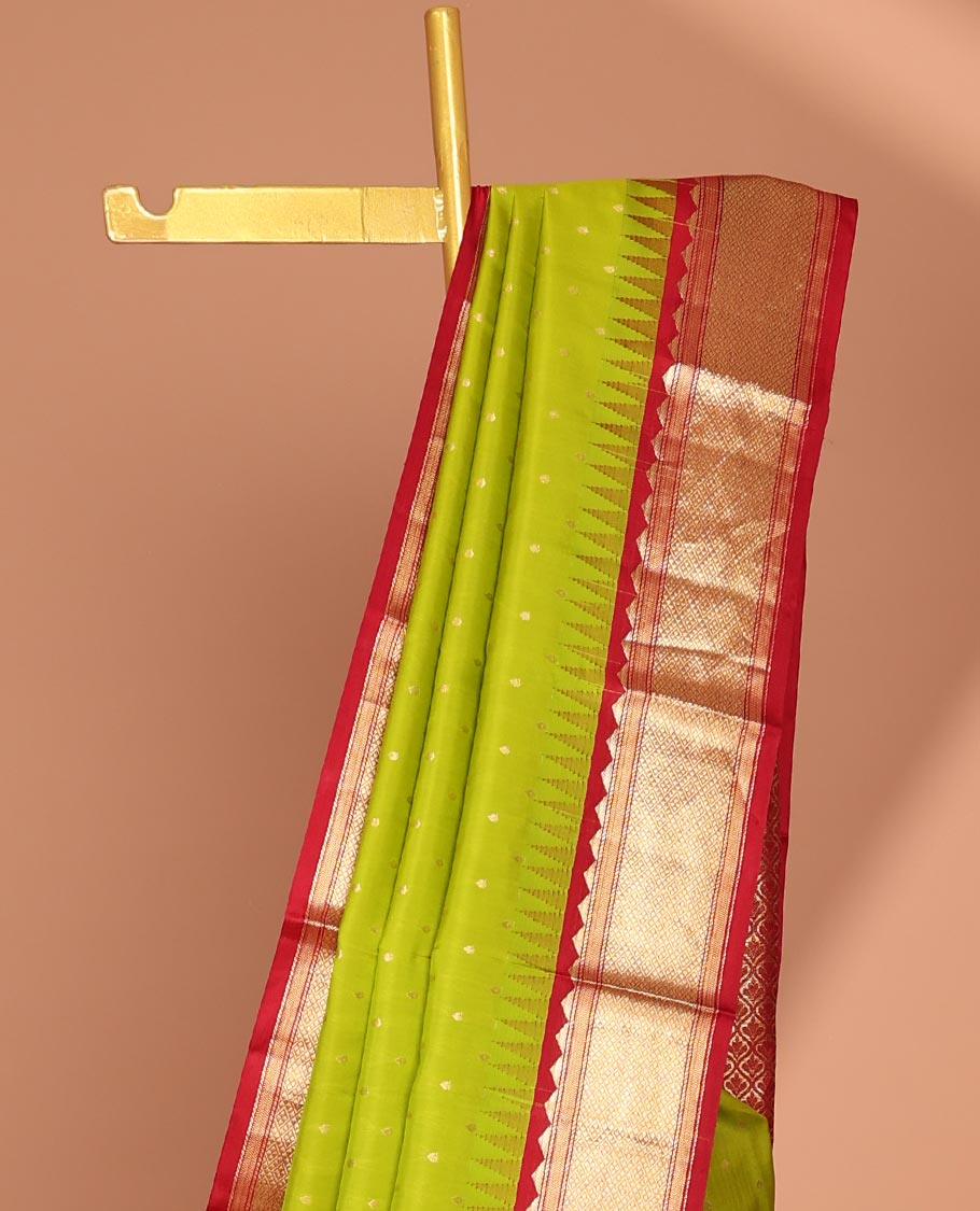 Green buttas silk saree, contrast border of rekku,banaras & jaal & pallu of ogee pattern