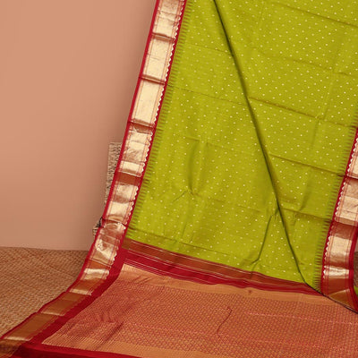 Green buttas silk saree, contrast border of rekku,banaras & jaal & pallu of ogee pattern