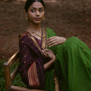 Green Handloom Kadapa cotton saree adorned with red Meenakari buttis