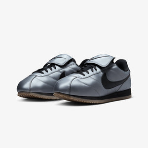 NIKE | CORTEZ { MTLC COOL GREY/BLACK-GUM DARK BROWN