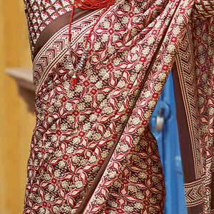 Brown Floral Ajrakh Printed Satin Saree With Tassels